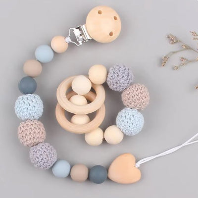 Attache tétine avec bracelet de dentition