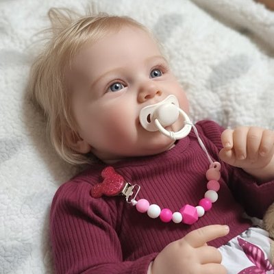 Attache tetine bébé au berceau