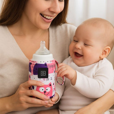 Bebe joue avec Chauffe biberon portable​