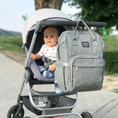 sac a dos a langer bebe dans une poussette